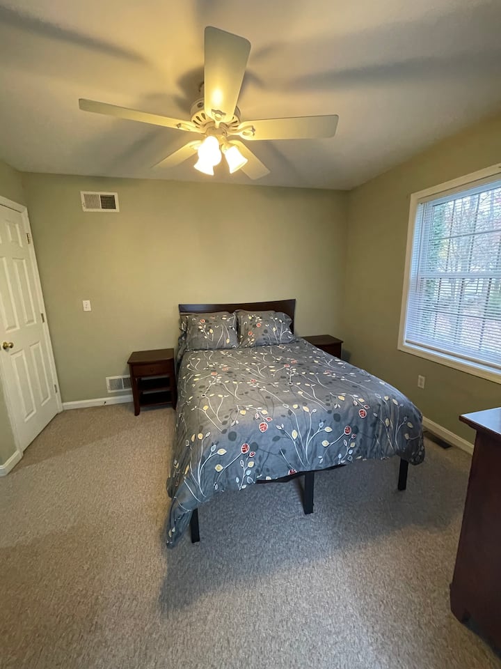 Upstairs Bedroom 1 - Full Bed, two closets, dresser with mirror, and two nightstands