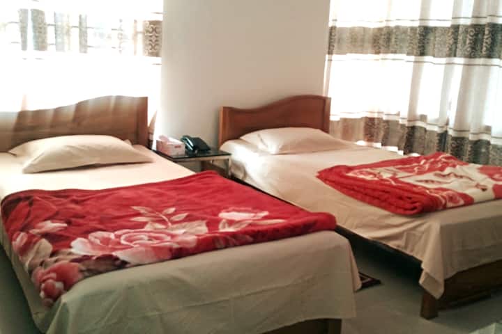 Twin Room

Single Bed- 02

Pax: 02 Persons

AC Room, Private Toilet with Amenities, Hot Water, Complimentary Breakfast for 03 Persons, Wi-Fi & Dedicated Internet Connection (24/7),  Free Mineral Water, Lift & Generator (24/7)
