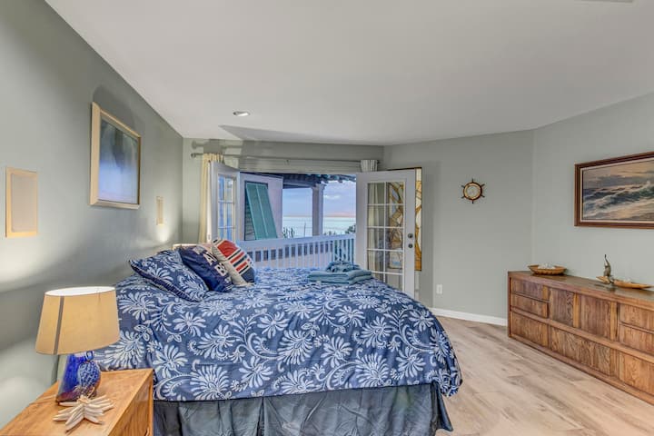 Lower level master suite with balcony, beach and ocean views and king bed. Big screen TV and Roku in this room. This ensuite master has a jacuzzi tub and a shower.