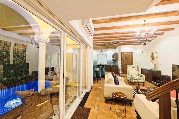 The outdoor patio and living room space divided with sliding doors.