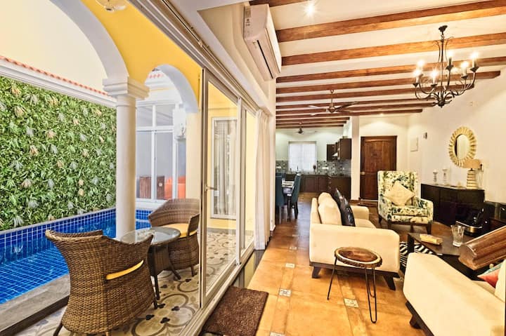 The outdoor patio and living room space divided with sliding doors.