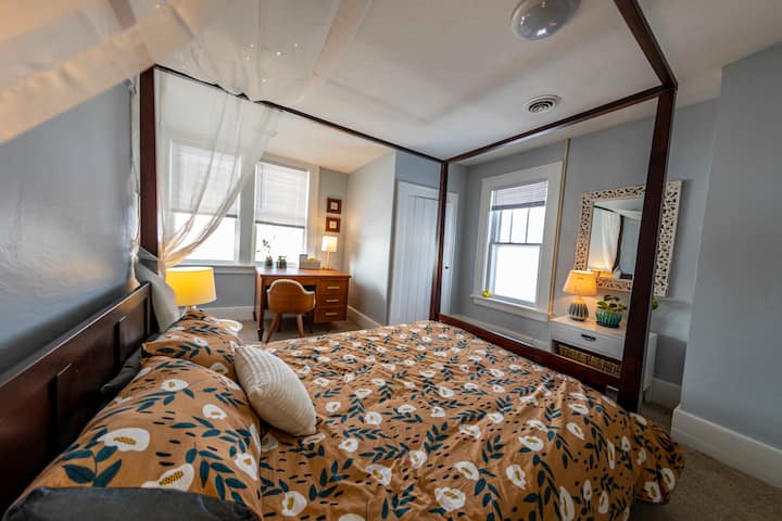 Bedroom 2 has a plush memory foam queen bed, desk, closet, and cabinetry for plenty of clothing storage.