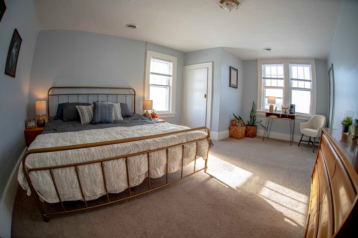 The master bedroom features a plush memory foam king mattress, a desk / coffee nook, 38" TV, and plenty of clothing storage.