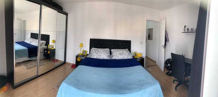 Bedroom with queen-size bed and balcony 