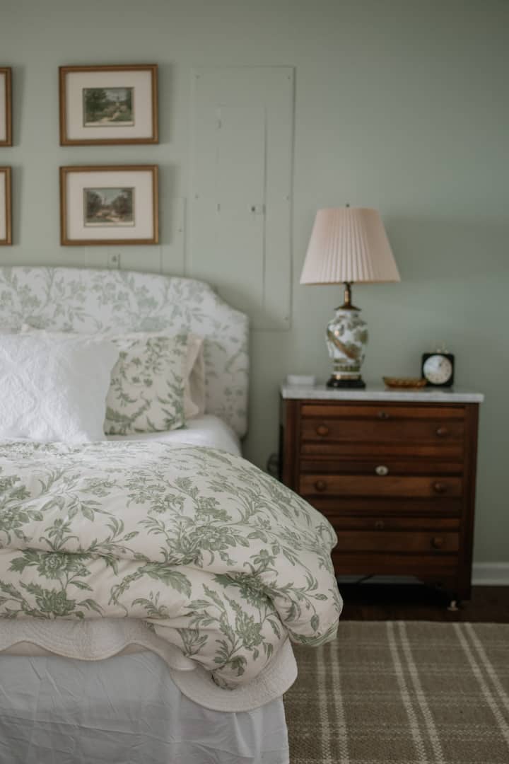 The guest bedroom is a vision in calming green.