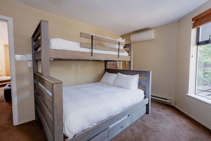 Guest room with Queen, Single Bunk and trundle bed below. Recently renovated (no photos yet taken) and includes a private workstation. 