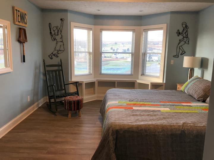 “Tennis Suite” - 2nd level bedroom with ensuite full bath with shower/tub combo. King sized bed with new memory foam mattress and two pull-out twin trundles (need to move night stands), both with new memory foam mattresses.