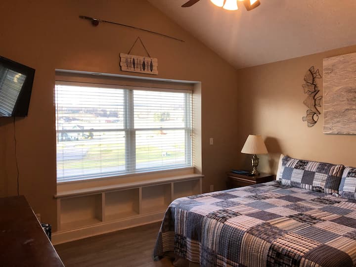 “Gone Fishing Suite” - 2nd level bedroom with shared full bath with shower/tub combo. King sized bed with new memory foam mattress and two pull-out twin trundles (need to move night stands), both with new memory foam mattresses.