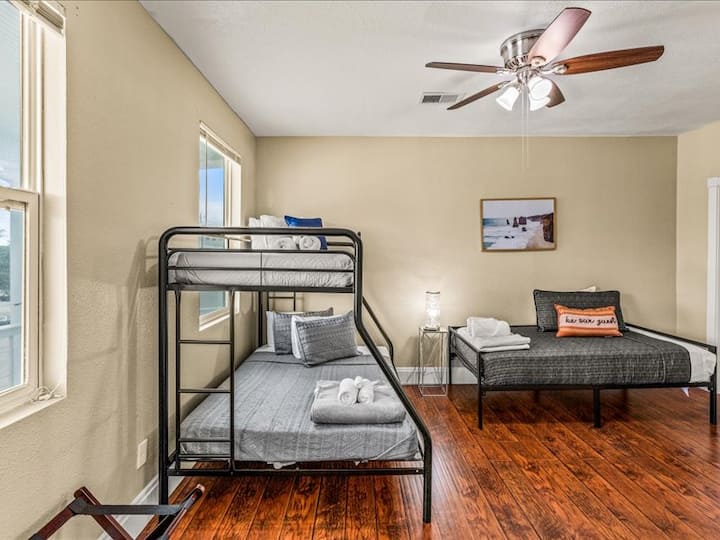1 queen bed and single twin in bedroom. Bunk is no longer in bedroom. TV is located in this room .bedroom joins to another bedroom. ideal for families.