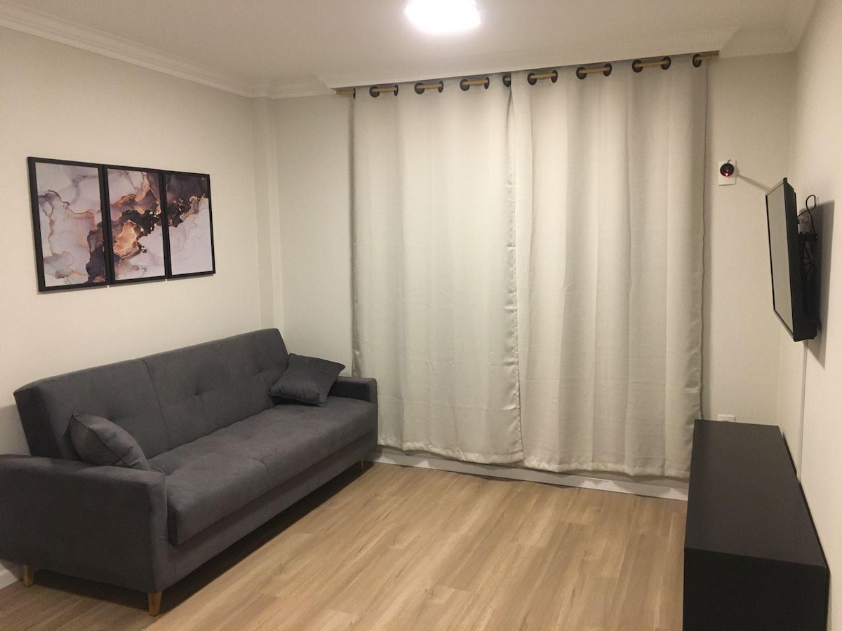 Sala de estar y comedor con sofá cama