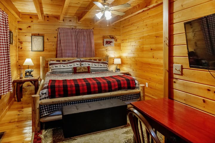 King size bed on the main floor with en-suite workspace and large closet.