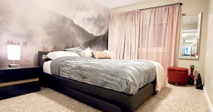 One of the bedrooms adorned with a giant wall graphic 
