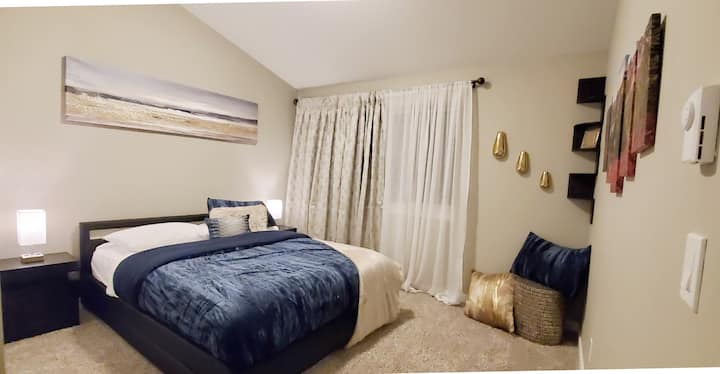 One of the largest bedrooms in blue with gold accents