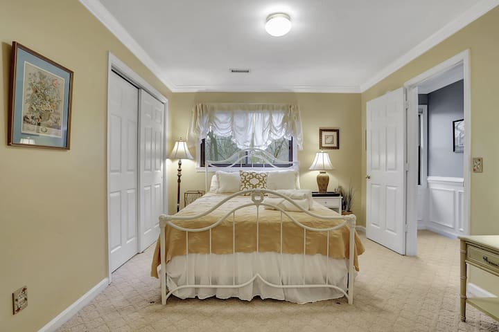 Bedroom #2: Yellow bedroom with queen bed.