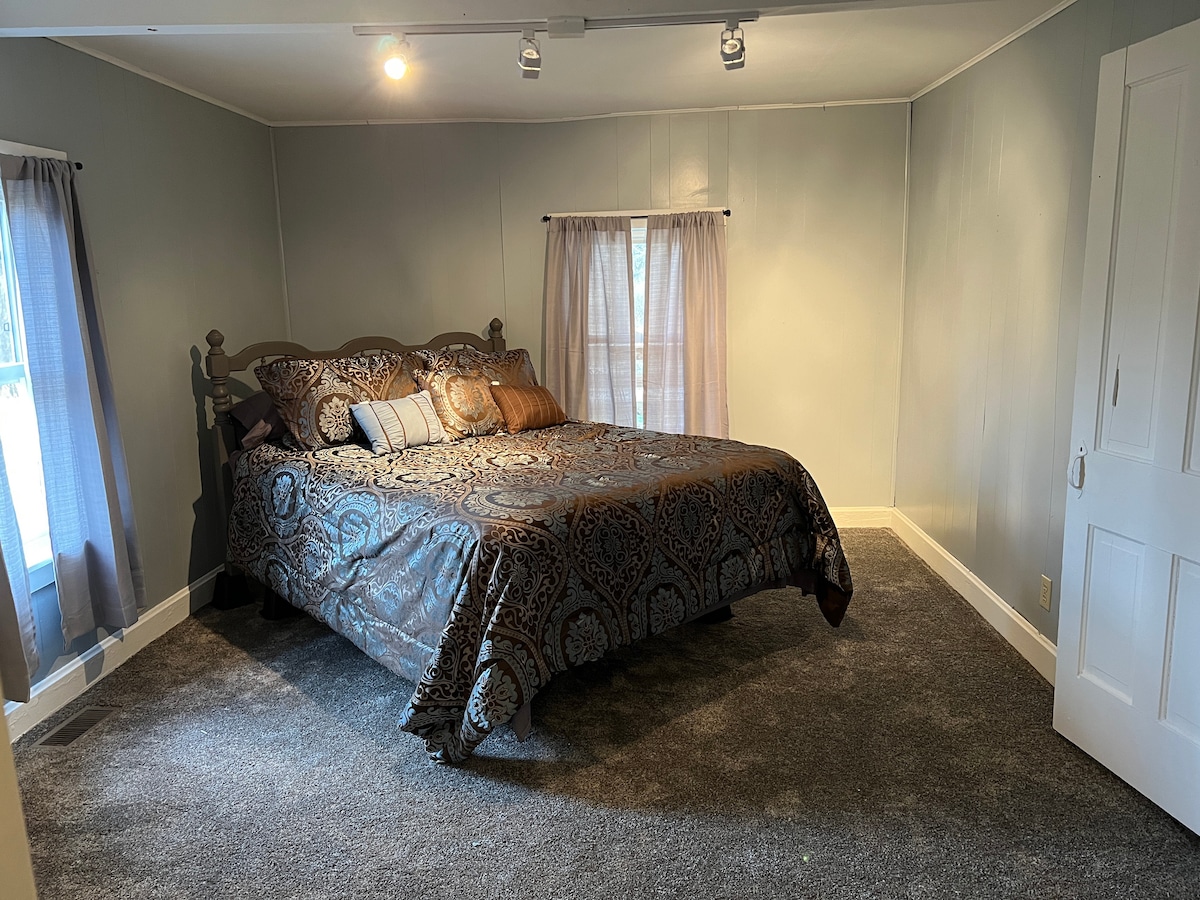 Queen downstairs master bedroom. Door. 