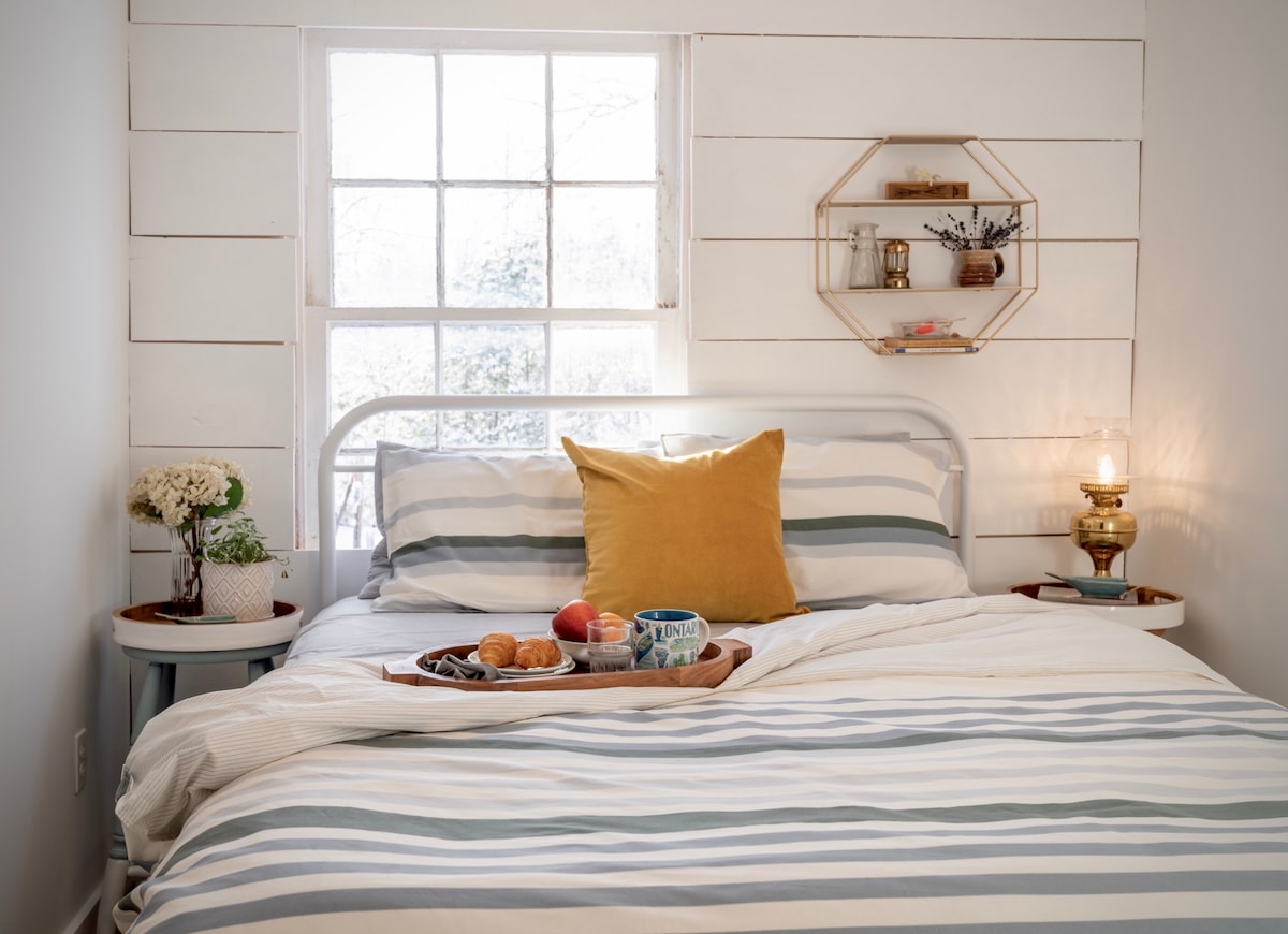 The Saltbox's fresh remix of vintage finds with modern coastal style, luxe amenities & bay views invite an ease of slow living while being well-cared for, inside & out.