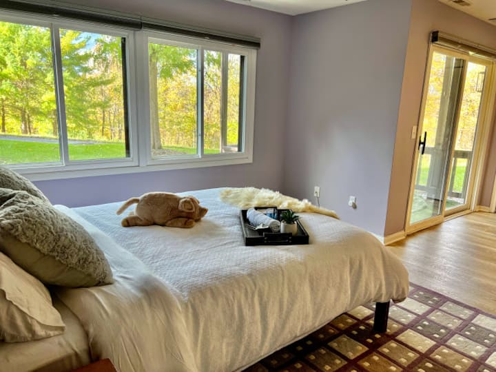 Main bedroom with doors onto the lower patio