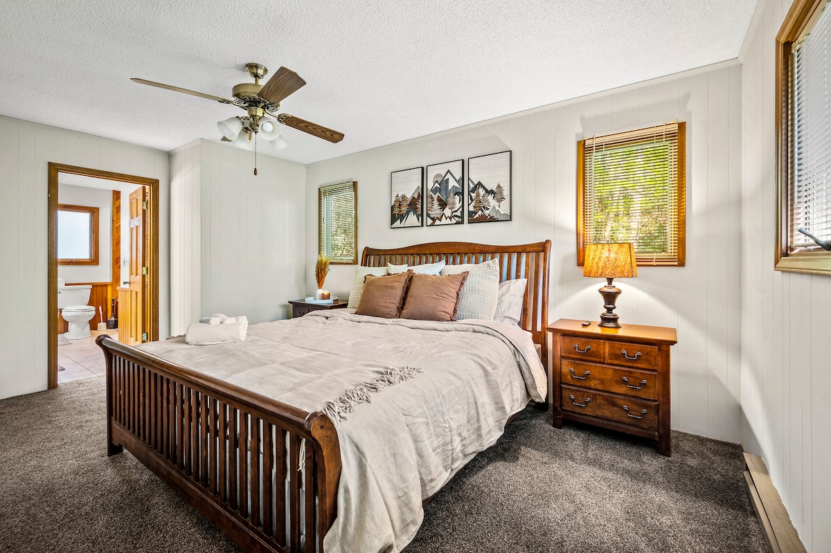 [BR #1, Main Level]  King bed with master suite to the left.  Roku TV in bedroom along with plenty of closet space in the bathroom.  Plenty of room for multiple a cribs or pack n plays.