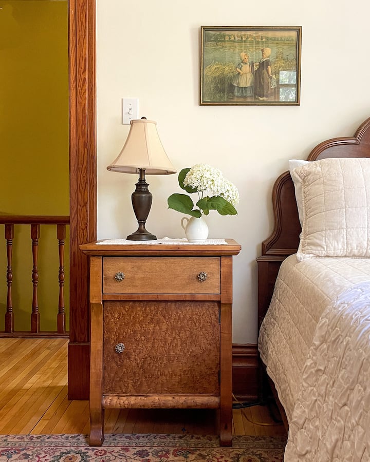 The "Baby Room" (because it's the smallest), at the top of the stairs has a full size bed, a dresser,  and 2 big windows.
