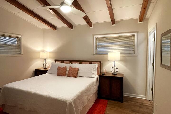 Master bedroom features a king sized bed