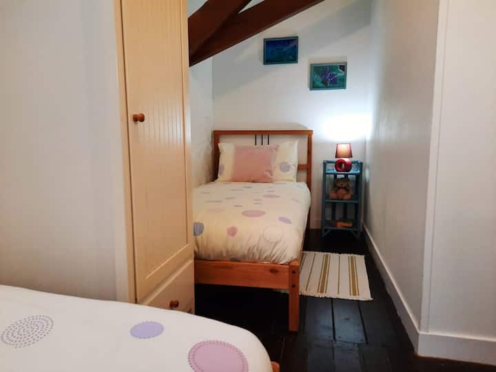 Plenty of space to sleep and play. This bedroom offers two single beds with plenty of storage including a wardrobe and draws. All bedrooms include a fan and heater depending on the time of year.