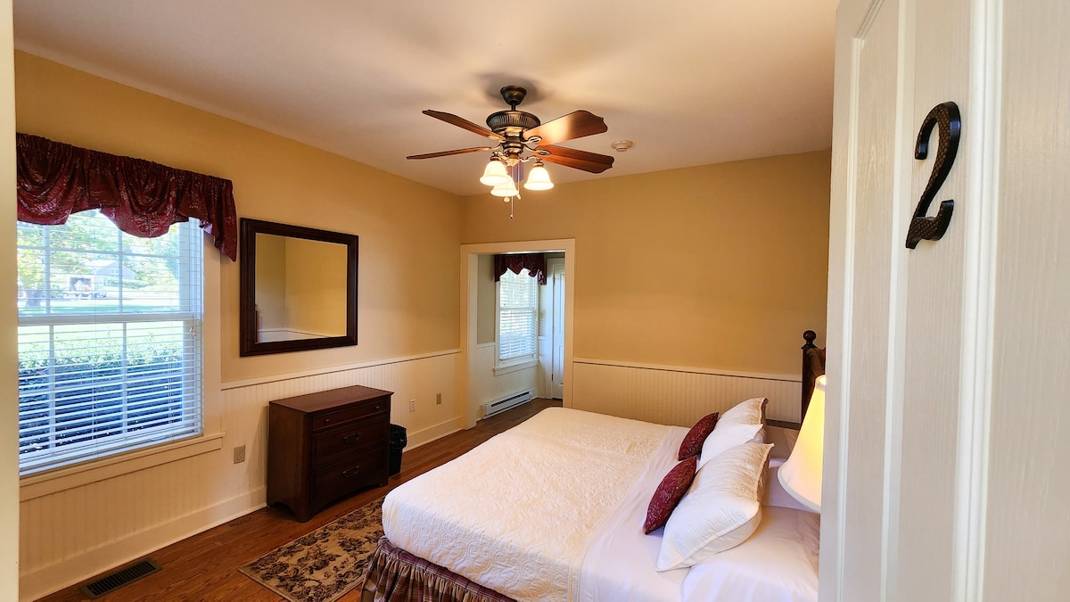 Main House - 1st Floor Bedroom #2 
Can be set up as two single beds upon request.  Room has one small dresser, closet and private ADA full bathroom.