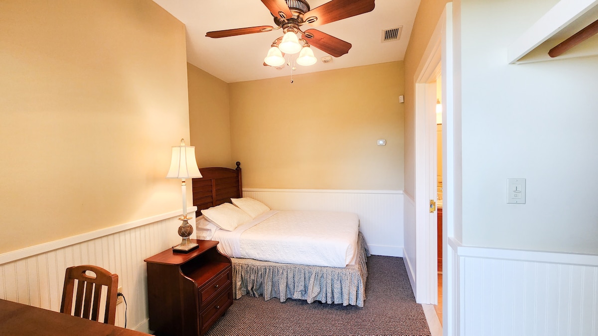 Guest House - Room #6 - Room has a small desk and en suite bathroom.