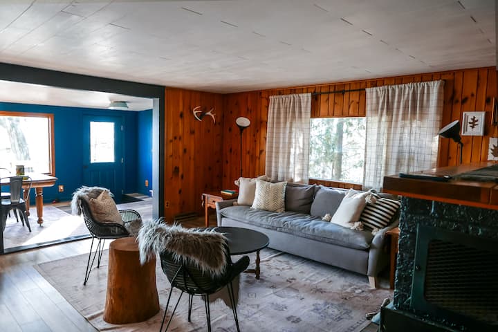 Living area with seating & tables ready for a conversation with friends or a friendly game. 