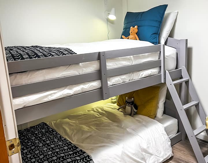 The Bunk Room - A kid's dream, based on our kid's reviews. 2 twin mattresses with personal reading lamps & a little furry friend.  While these are extra adorable there is no age limit to who can sleep here!