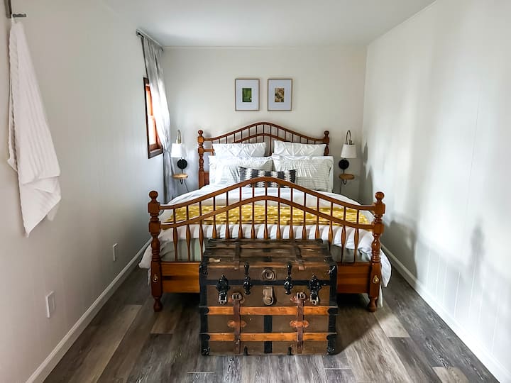 The Large Bedroom - Queen size bed with side lamps that have built in USB ports.  The trunk holds the bedding for the sofa, if needed. 