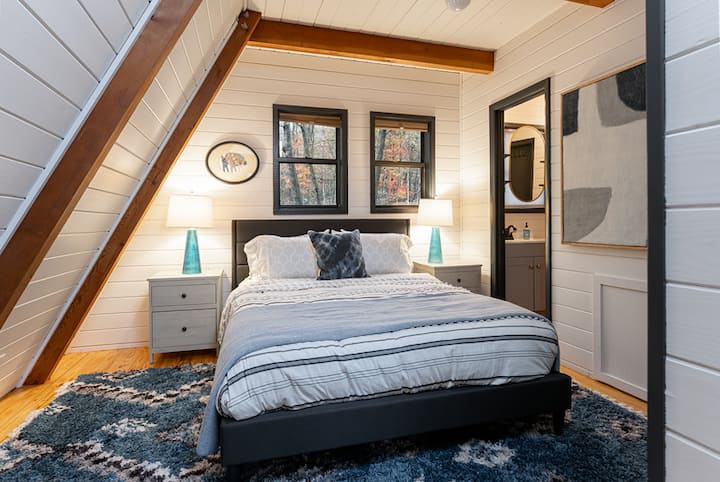 The bedroom on the ground floor has a queen bed and has doors that can be closed off from the rest of the house