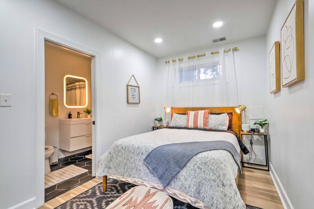 Well-appointed bedroom with Serta mattress, comfortable bedding, nightstand lamps with USB ports, white noise machine, art, bench, and more.