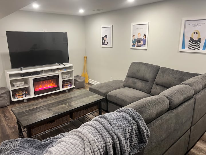 Downstairs movie room with fireplace