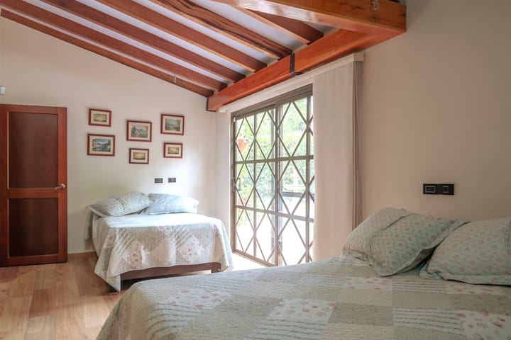 Bedroom I - 5 PAX: 2 double beds, 1 single bed.