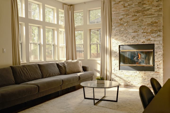 Cozy up in an abundance of natural light and a gas fireplace.