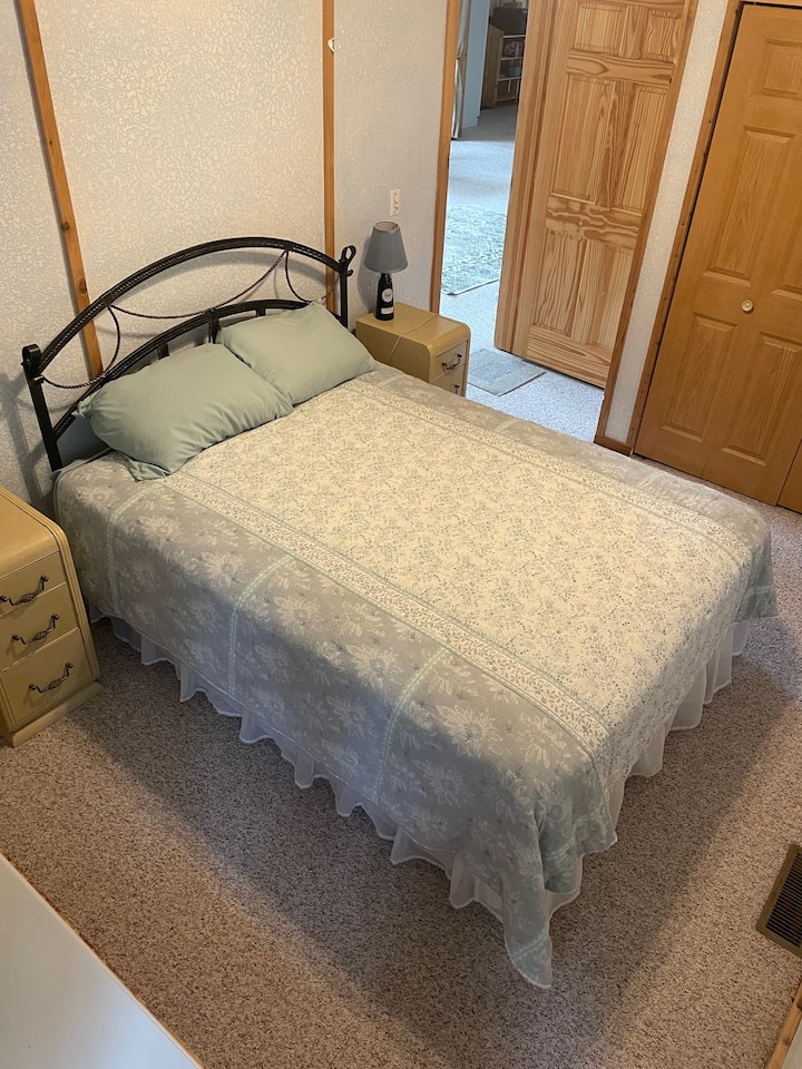 Downstairs bedroom with queen bed, just off the great room. 