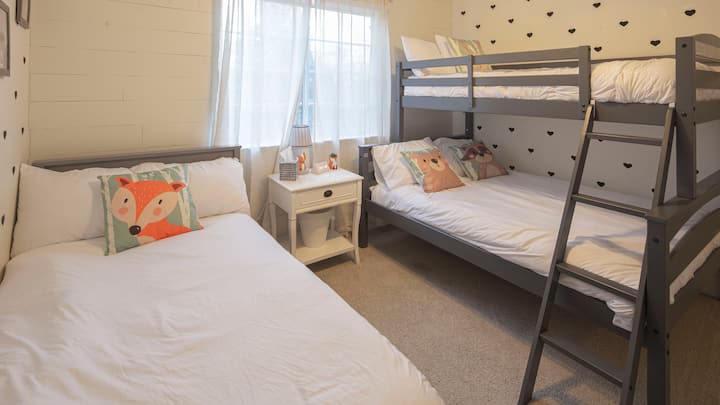 Another upstairs bedroom has a twin over full bunk bed and a twin single bed. Perfect for kids! (weight limit on top bunk)