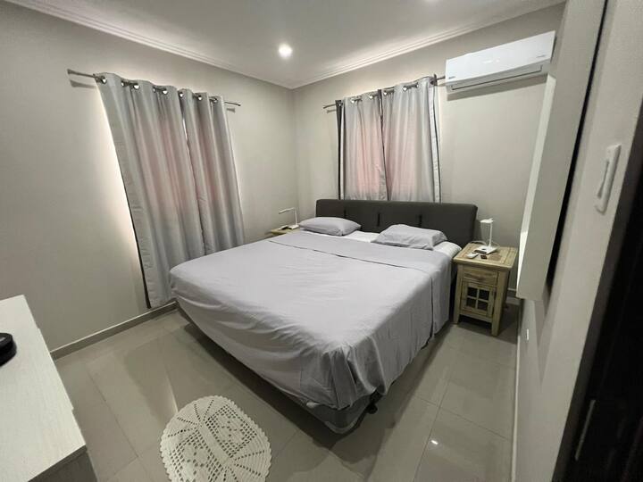 Master bedroom with a king size bed 2x2 meters, airco and TV.