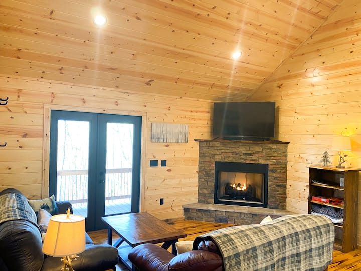 Living Room:  Pull out sofa with full size mattress,  full size sheets and blankets.  Leather loveseat, games, ventless gas fireplace, and 4k HDR high end 55" LED TV with soundbar.