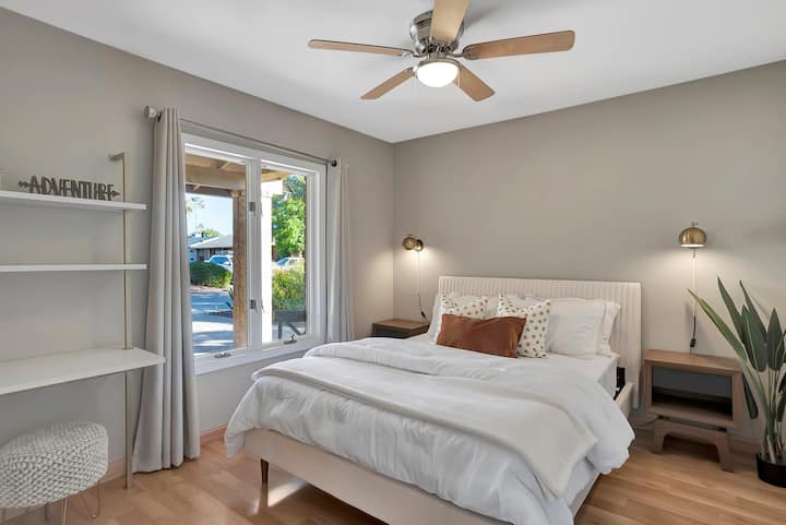 Enjoy the modern vibes in our second bedroom, featuring a queen size bed and stylish decor for a comfortable and chic retreat