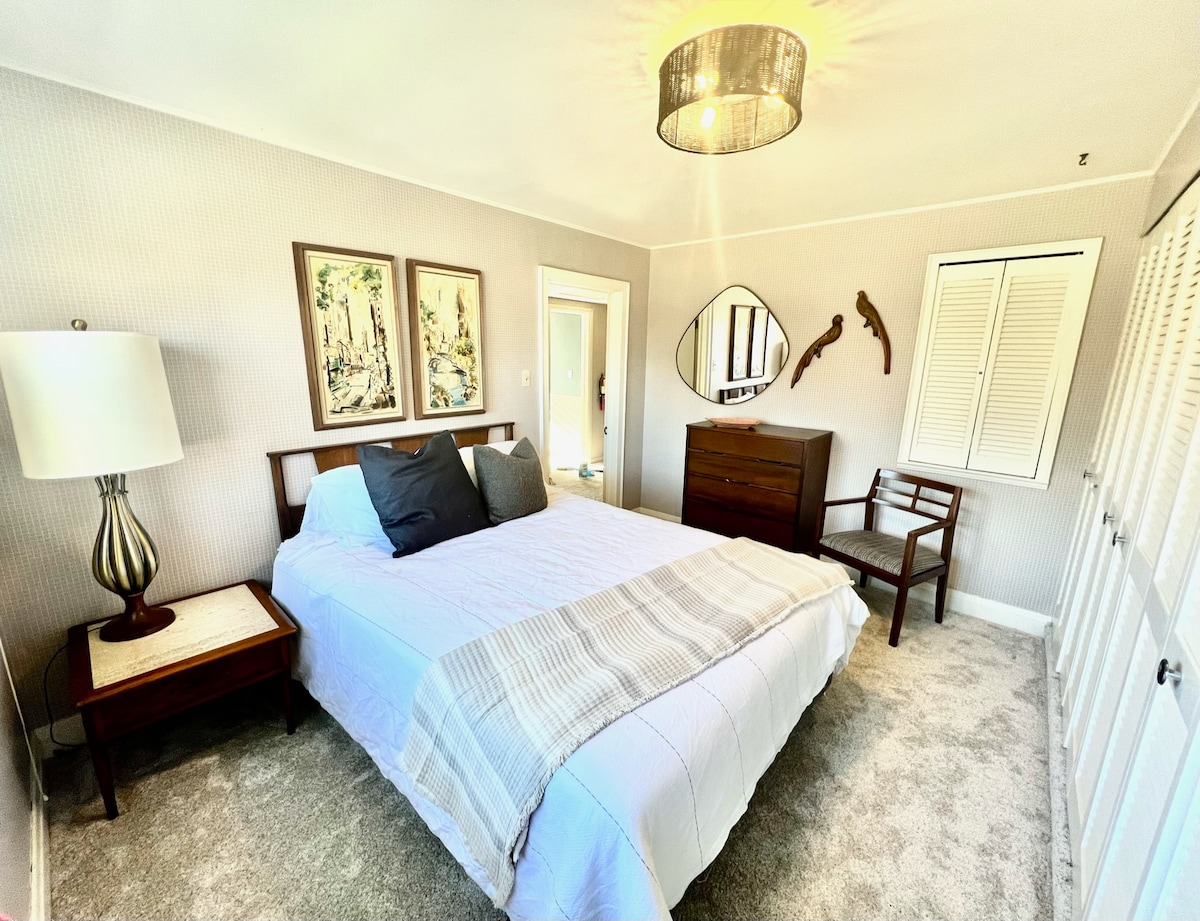 Bedroom #2 features a queen size bed and a lot of built-in shelves/closet space.