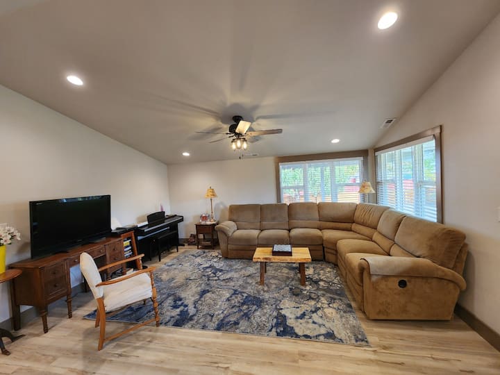 Living room with piano. TV works with DVD’s only so enjoy a movie and popcorn provided.