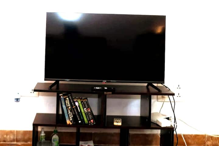 We have upgraded to a 42 inch smart TV! So you can use your netflix/prime accounts to watch your favorite shows.