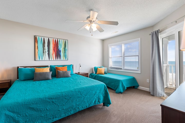 Indulge in the ultimate beach getaway in our second master bedroom, complete with a king and twin beds and direct access to the second-floor balcony.