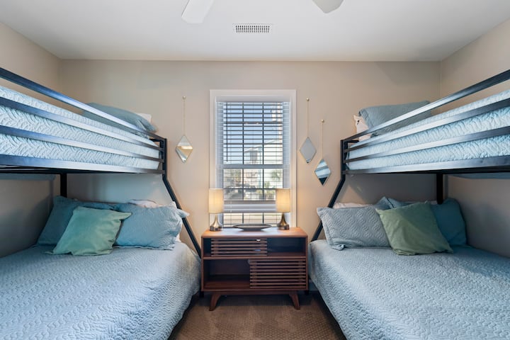 Rest comfortably in our beach house's first-floor bedroom, featuring a twin over full bunks, ideal for kids or young adults.