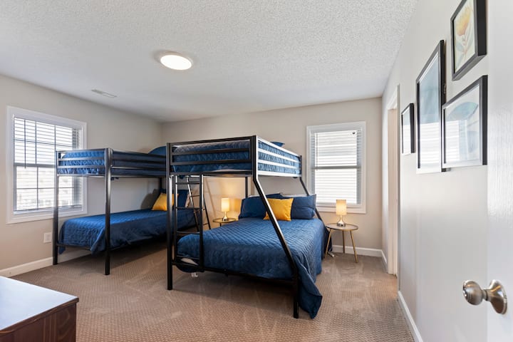 Relax in style in our rear second-floor bedroom, designed for ultimate comfort and convenience with multiple bunk beds.