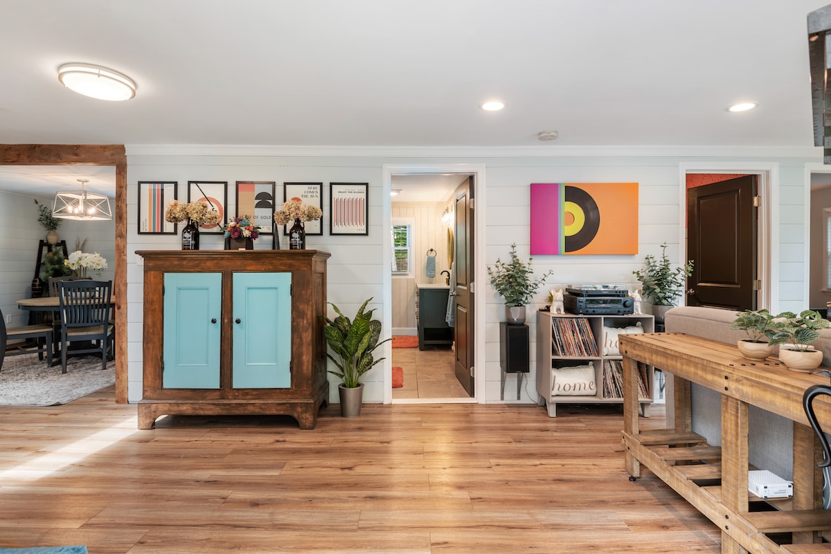 Our colorful, bright, and airy living room with a sweet record collection!