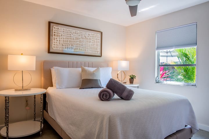 Queen guest bedroom with comfortable beds, quality bedding & and plush pillows.