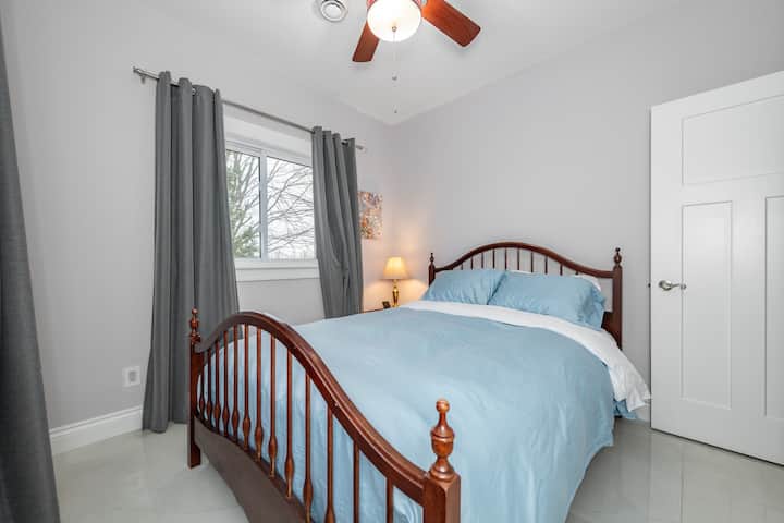 Plush comfort of a 14-inch high-quality foam mattress with soft linen bedding and extra blankets and waterfront view.