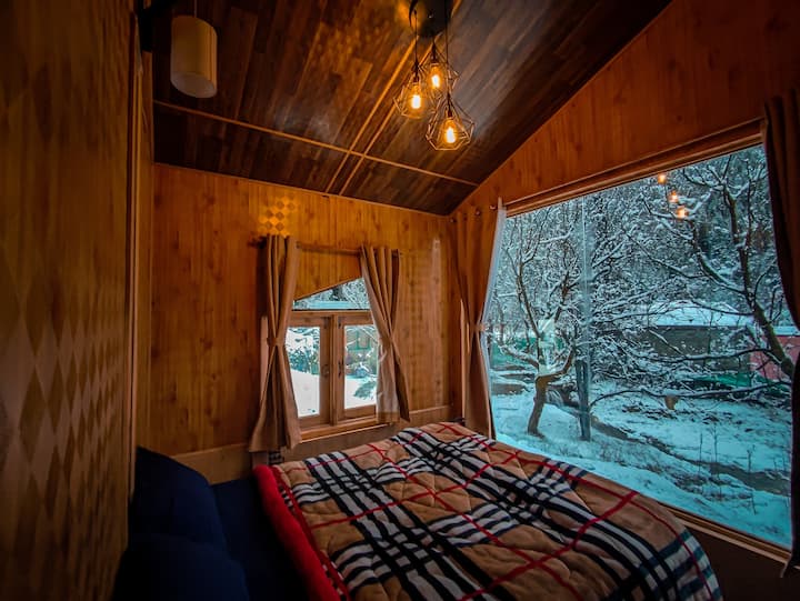 The coolest part of our comfy cozy cottages is the massive window to soak in the view outside! 